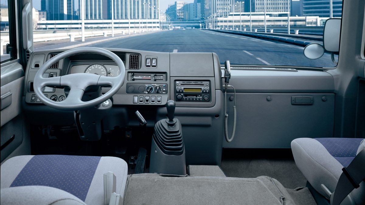 The dashboard, control panel and steering wheel of Nissan civilian
